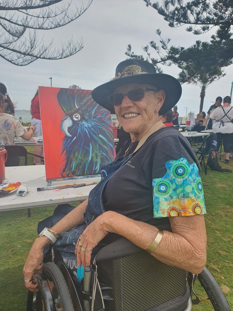 Aunty Kay Sadler (chairperson of FPDN board) creating a gorgeous cockatoo artwork to celebrate IDPWD organised by her local council (Hastings Council).